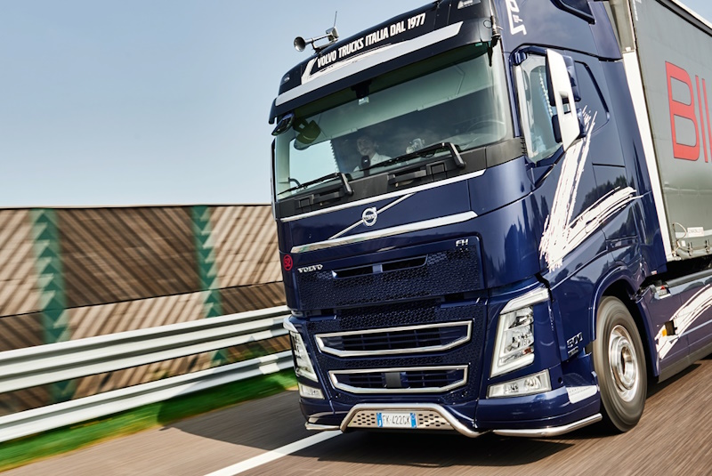 Blue Freight Truck Driving on Highway