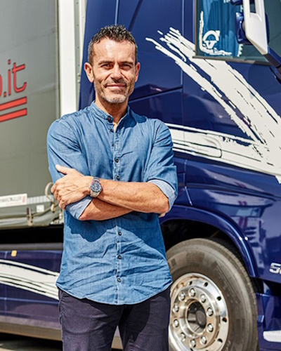 Fabio Bilibio Standing next to a Truck