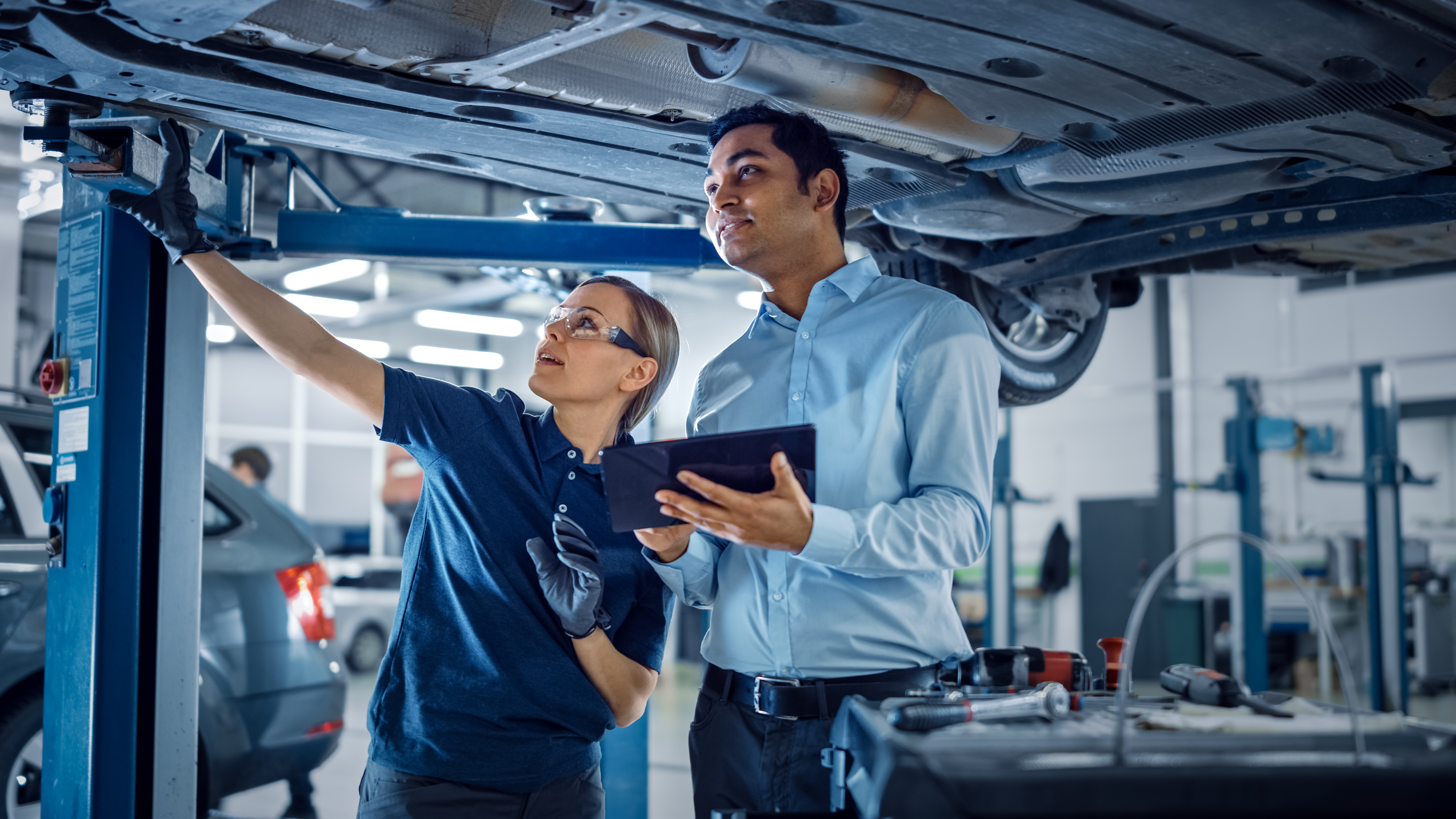 Man and woman reviewing car