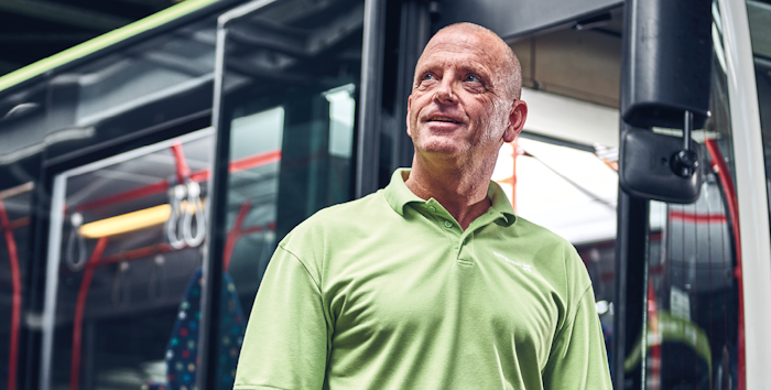 Man in front of bus