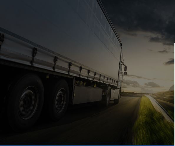 Truck driving down road