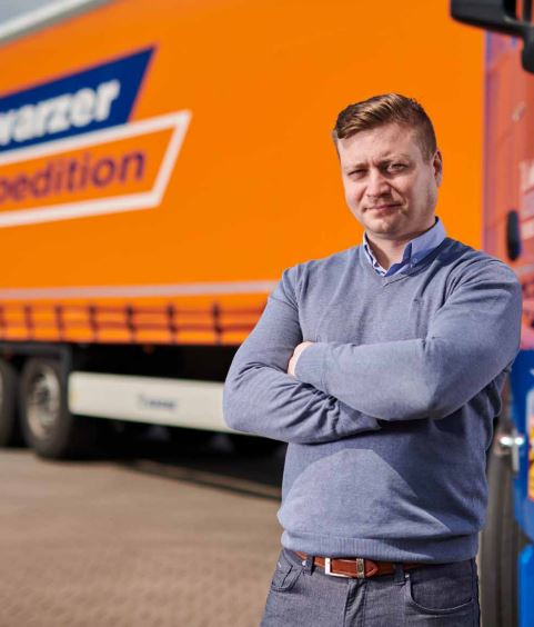 Man in front of truck